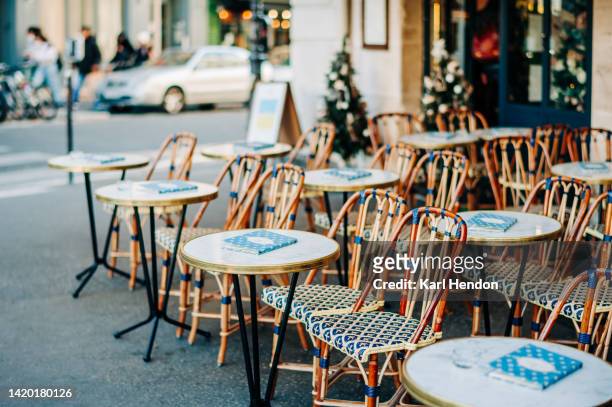 a daytime view of a paris cafe - french cafe stock-fotos und bilder