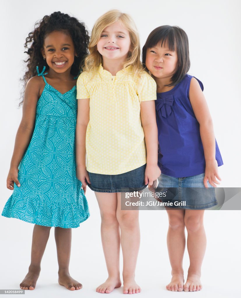 Smiling girls standing together