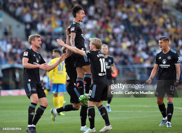 Jens Castrop of 1. FC Nürnberg jumps in the air as he celebrates scoring during the Second Bundesliga match between Eintracht Braunschweig and 1. FC...