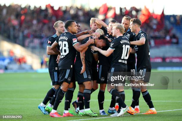 Jens Castrop of 1. FC Nürnberg celebrates with team mates after scoring during the Second Bundesliga match between Eintracht Braunschweig and 1. FC...