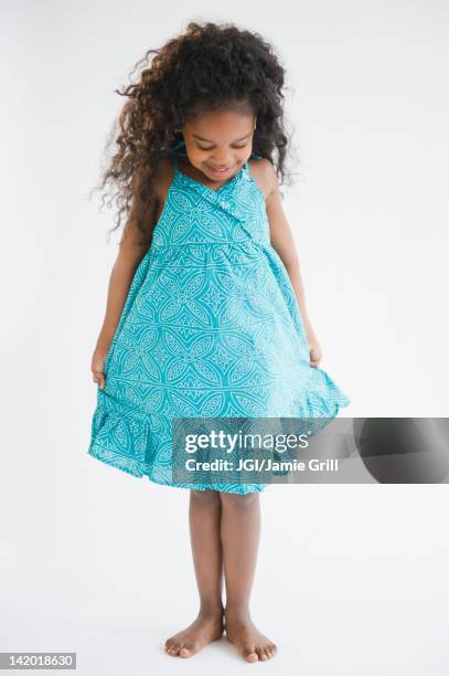 mixed race girl admiring her dress - beautiful barefoot girls imagens e fotografias de stock