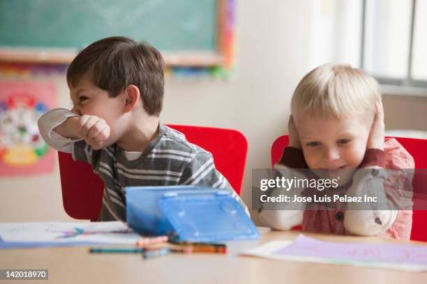 caucasian boy wiping his nose in classroom - volume 2 ストックフォトと画像