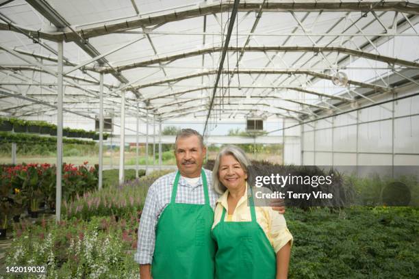 hispanic workers standing in greenhouse - houston texas space stock pictures, royalty-free photos & images