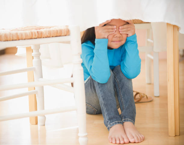 Under Table 245 Hiding Under Table Stock Photos, High-Res Pictures, and Images ...