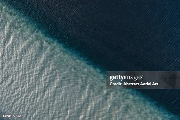 drone image looking down on a river confluence, iceland - two tone stock-fotos und bilder