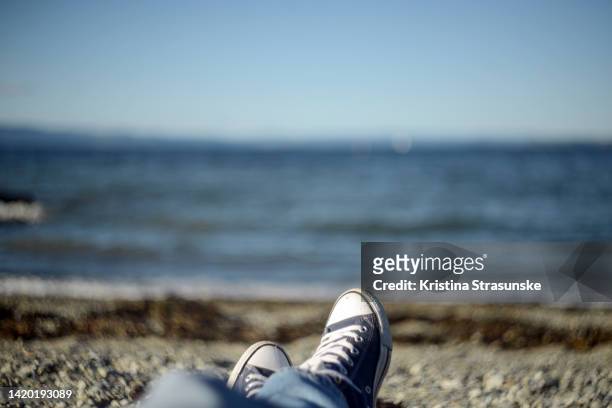 sitting by a sea, seen from a personal perspective - trondheim stock pictures, royalty-free photos & images