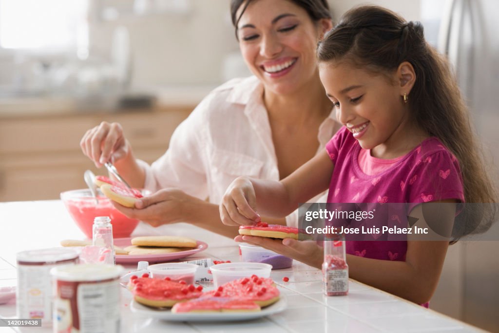 Mother and daughter making Valentine's cookies