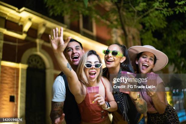 friends having a fun outdoors at night - gay sunglasses stock pictures, royalty-free photos & images