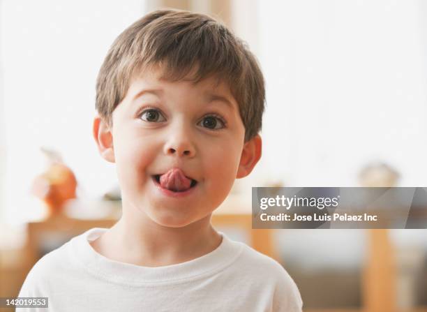 cute caucasian boy sticking out tongue - 5 funny foto e immagini stock