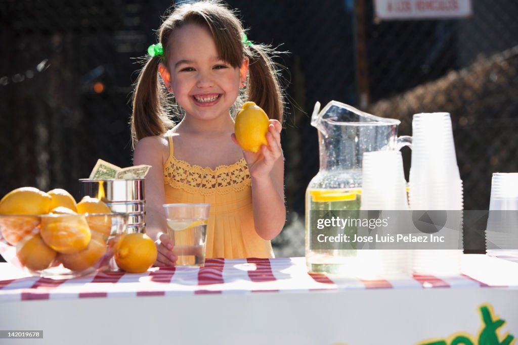 Caucasian girl operating lemonade stand