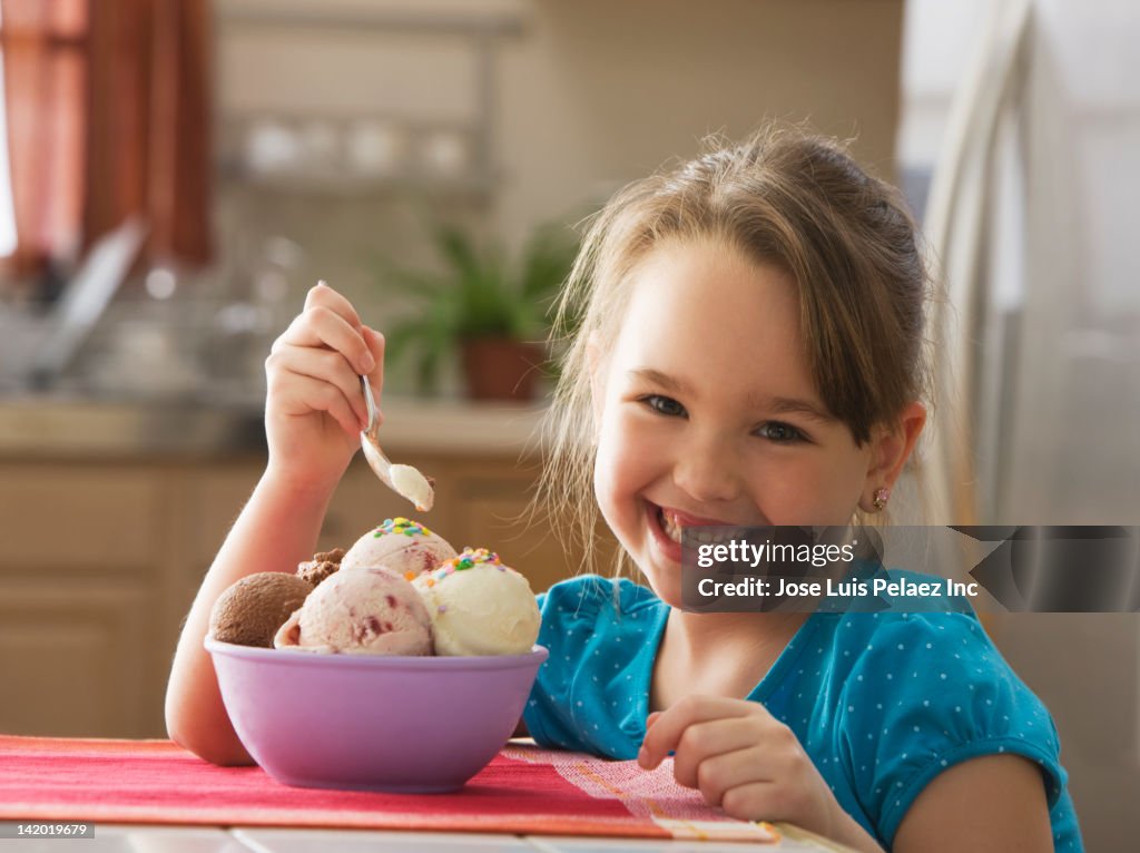 Caucasian girl eating bowl of ice cream