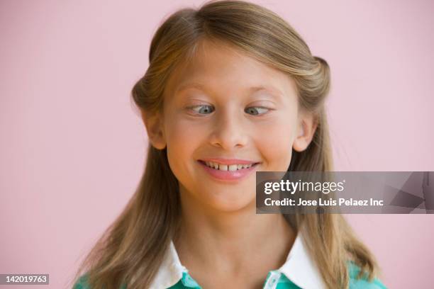 caucasian girl crossing her eyes - cross eyed 個照片及圖片檔