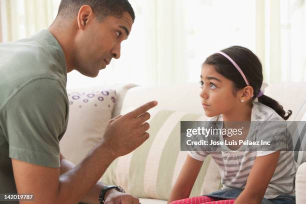 father giving daughter lecture - repreensão imagens e fotografias de stock