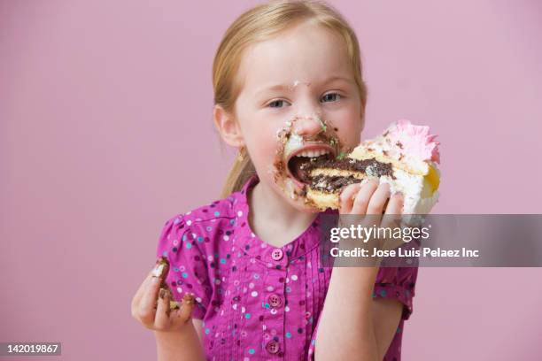 messy girl eating birthday cake - slice cake stock pictures, royalty-free photos & images