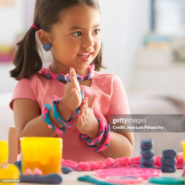 caucasian girl playing with clay - clay earring stock pictures, royalty-free photos & images