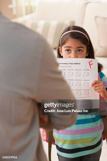 daughter showing father her test score - miss f stock pictures, royalty-free photos & images