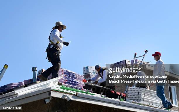 Lakewood, CA Installing a roof is hard work, during a heatwave safety is crucial, at a house in Lakewood on Friday, September 2, 2022. Richard...