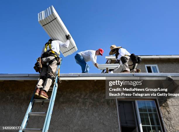 Lakewood, CA Installing a roof is hard work, during a heatwave safety is crucial, at a house in Lakewood on Friday, September 2, 2022. Richard...