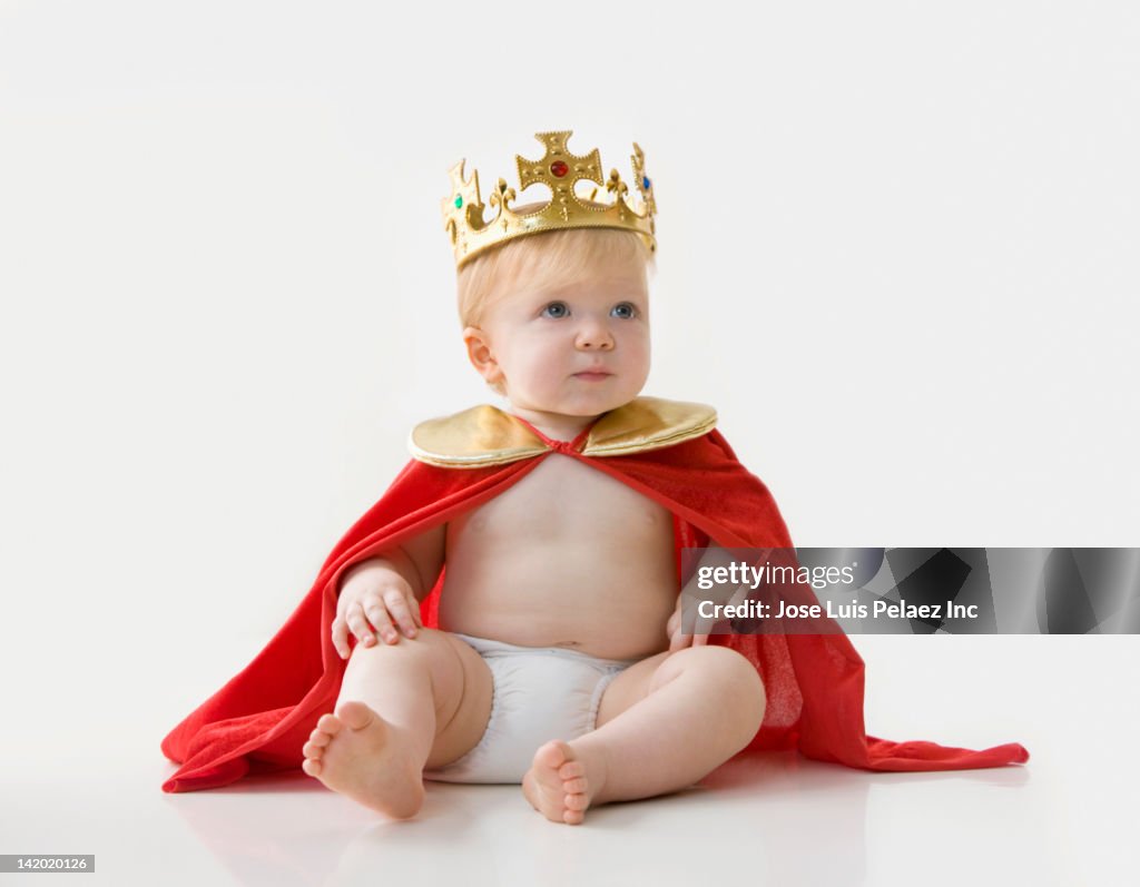 Caucasian baby boy dressed as king
