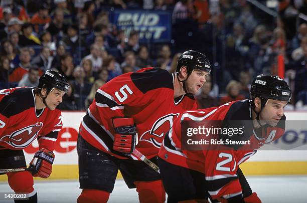 Left wing Andreas Salomonsson of the New Jersey Devils and his teammate, defenseman Colin White, take a defensive stance during the NHL game against...