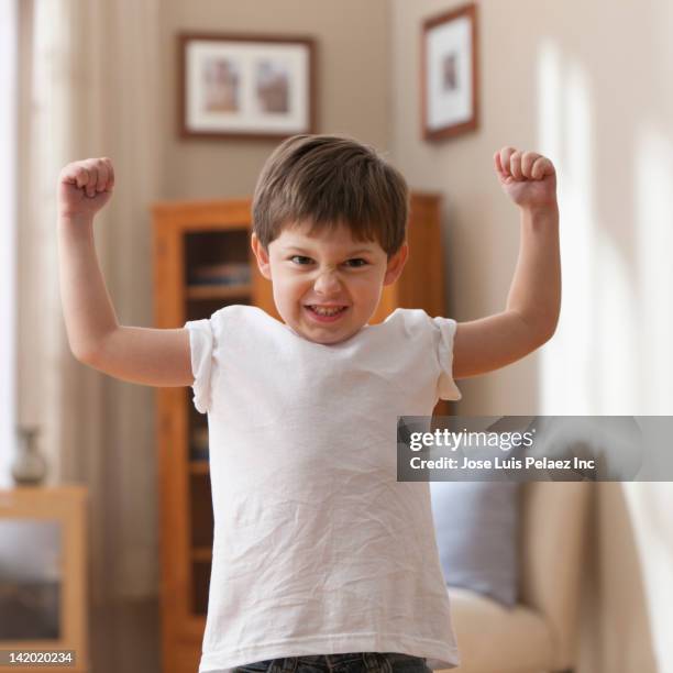 caucasian boy flexing muscles - kid strong stock pictures, royalty-free photos & images