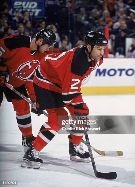 Left wing Andreas Salomonsson of the New Jersey Devils and his teammate, defenseman Colin White, skate on the ice during the NHL game against the...