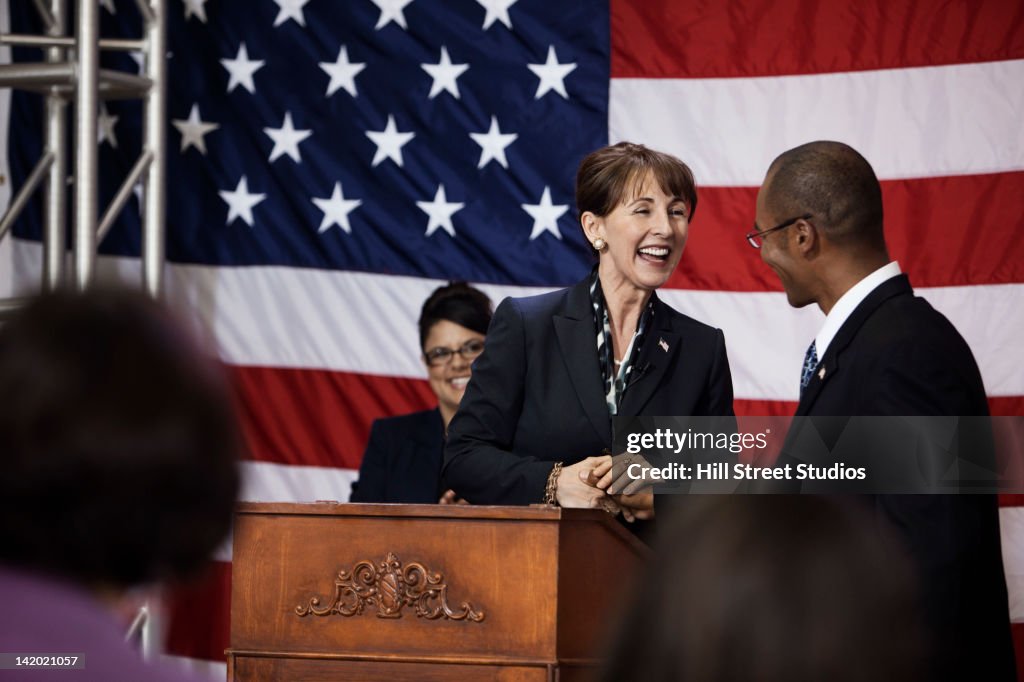 Female politician making speech at podium