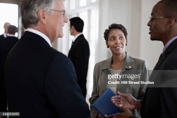 business people talking together - politica foto e immagini stock