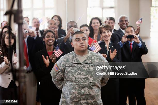 supporters clapping at political gathering - navy marine and army commandos stock-fotos und bilder