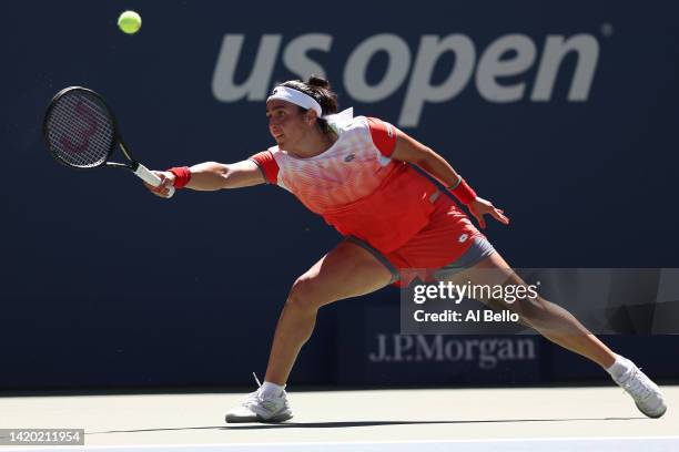 Ons Jabeur of Tunisia plays a forehand against Shelby Rogers of the United States during their Women's Singles Third Round match on Day Five of the...