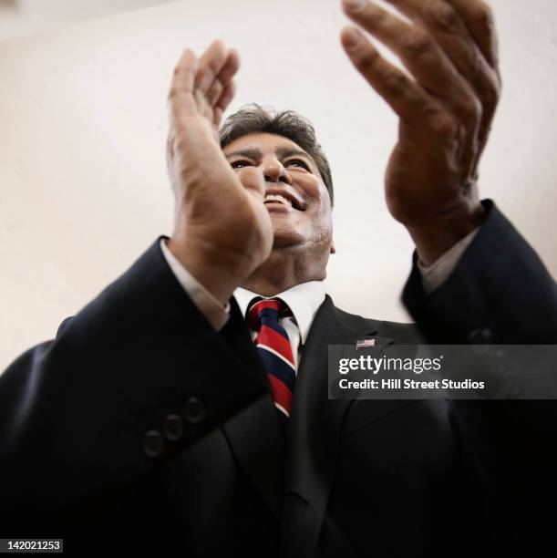 hispanic businessman clapping - lapel suit stock pictures, royalty-free photos & images