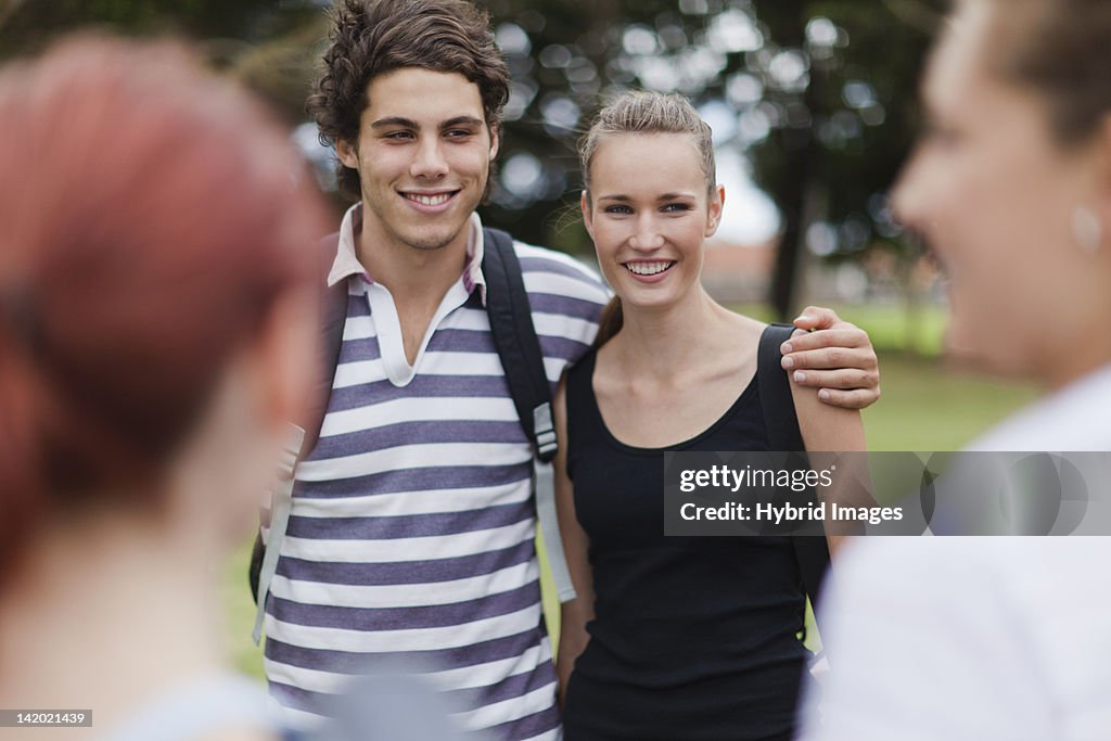 Couple hugging in park