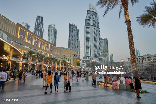 visiting the dubai mall - dubai shopping stock pictures, royalty-free photos & images