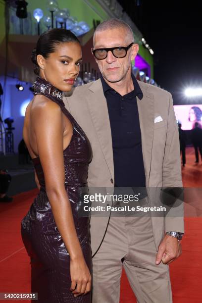 Tina Kunakey and Vincent Cassel attend the "Athena" red carpet at the 79th Venice International Film Festival on September 02, 2022 in Venice, Italy.