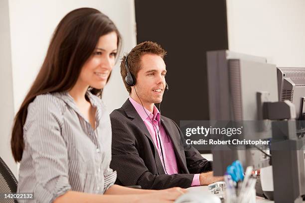 business people at work in office - answering email stock pictures, royalty-free photos & images