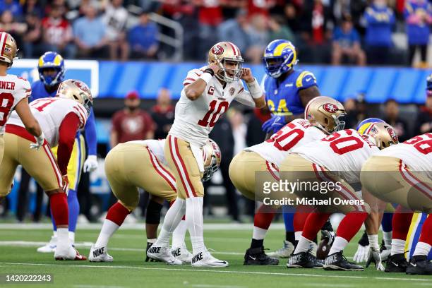 Jimmy Garoppolo of the San Francisco 49ers makes a call on the line during the NFC Championship NFL football game against the Los Angeles Rams at...