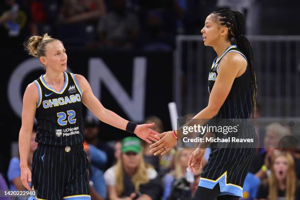 Courtney Vandersloot and Candace Parker of the Chicago Sky high five against the Connecticut Sun during the first half in Game Two of the 2022 WNBA...