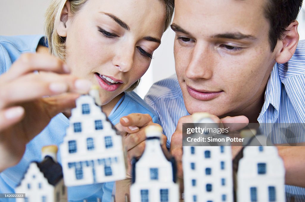 Couple examining model houses