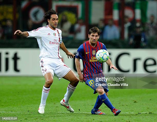 Alessandro Nesta of AC Milan and Lionel Messi of Barcelona compete for the ball during the UEFA Champions League quarter final first leg match...