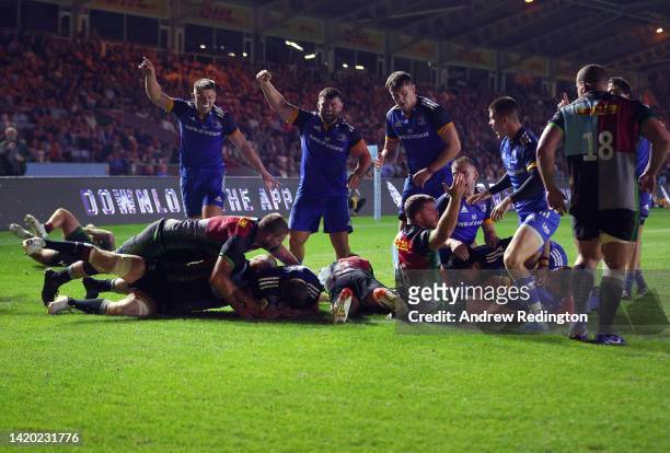 Leinster players celebrate after Scott Penny of Leinster scores a try during the Harlequins v Leinster Rugby pre-season friendly at Twickenham Stoop...