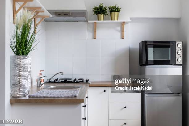 modern interior design small kitchen - mini fridge stock pictures, royalty-free photos & images