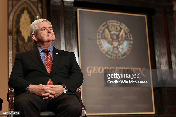 Republican presidential candidate, former Speaker of the House, Newt Gingrich waits to be introduced before delivering remarks to students at...