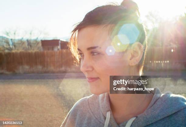 smiling teenager with a lens flare - relaxed sunshine happy lens flare bildbanksfoton och bilder