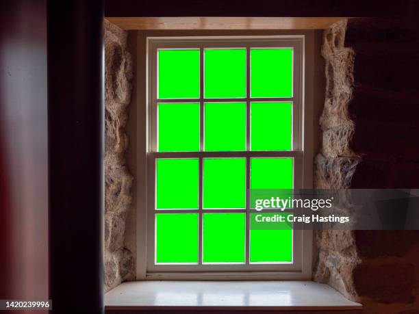 large to medium size old stone sash window frame green screen chroma key in rural style country house or farm environment. - skjutfönster bildbanksfoton och bilder