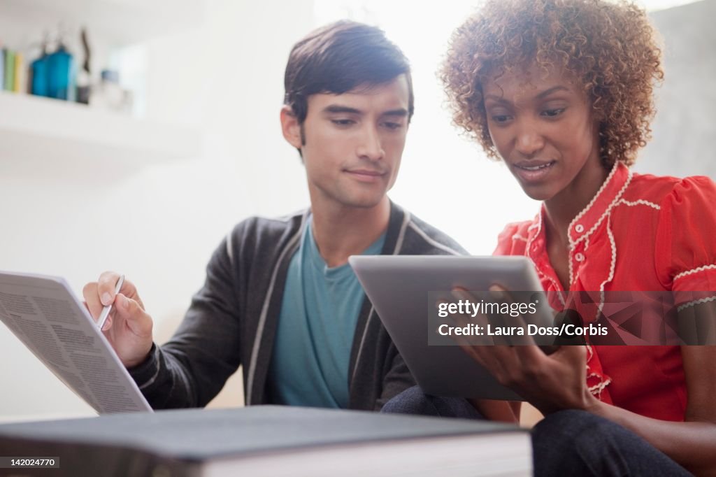 Man And Woman Using Tablet Pc High-Res Stock Photo - Getty Images