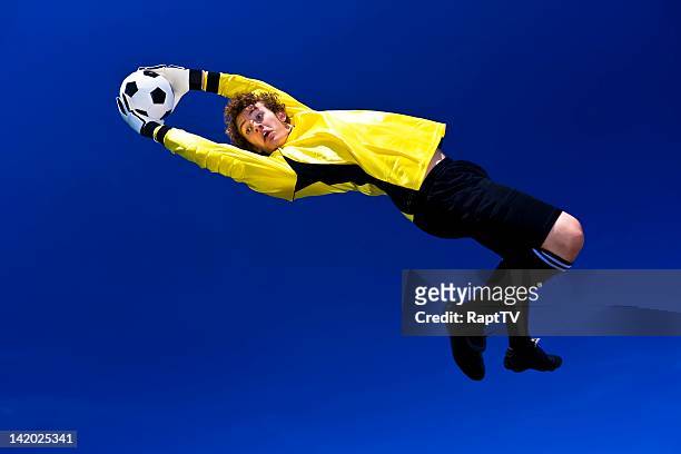goalkeeper stretches to make the save - baseball catcher ストックフォトと画像