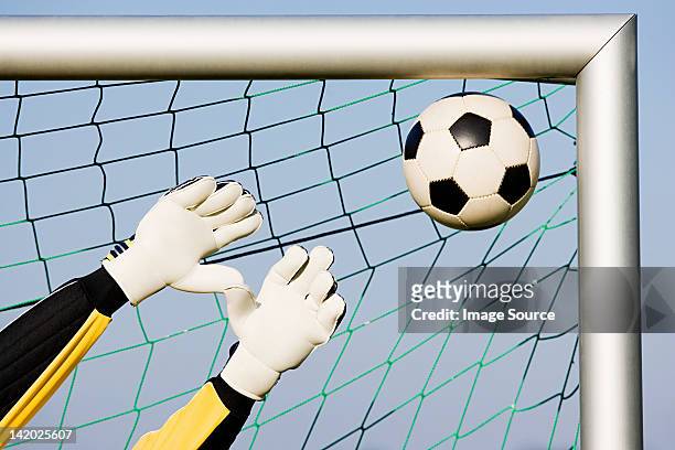 goalkeeper making a save - goalkeeper hand stock pictures, royalty-free photos & images