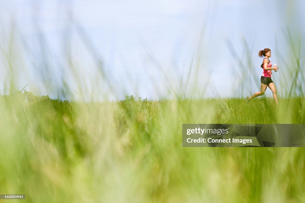 Running In Field Woman Running Through Field High-Res Stock Photo - Getty Images