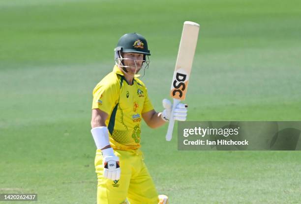 David Warner of Australia celebrates after scoring a half century during game three of the One Day International series between Australia and...