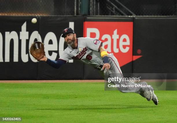 Jake Cave of the Minnesota Twins catches the fly out by Elvis Andrus of the Chicago White Sox during the first inning of a game at Guaranteed Rate...